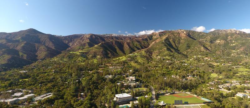 Aerial view of campus and mountains
